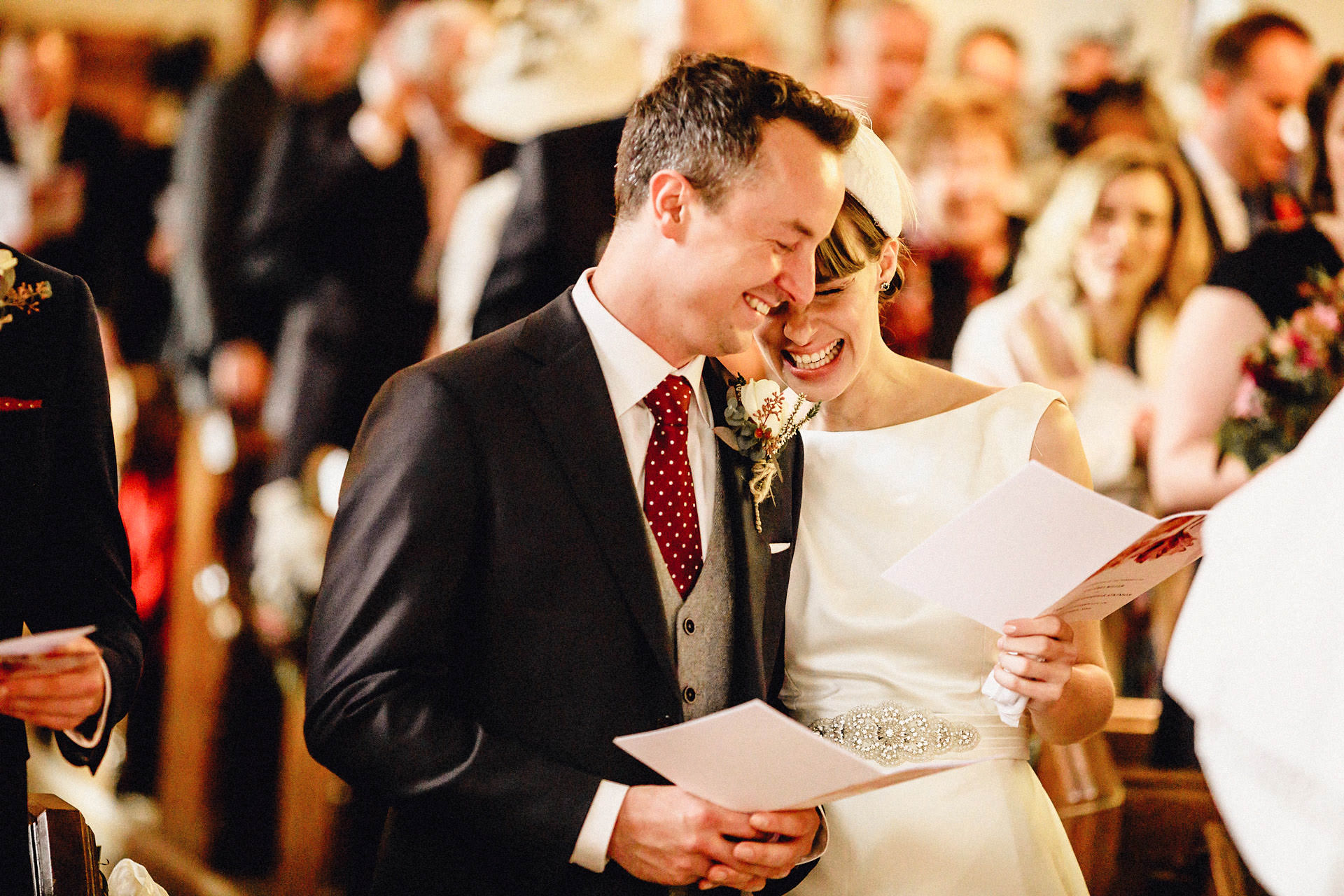lovely photo of the bride and bridegroom laughing during the ceremony