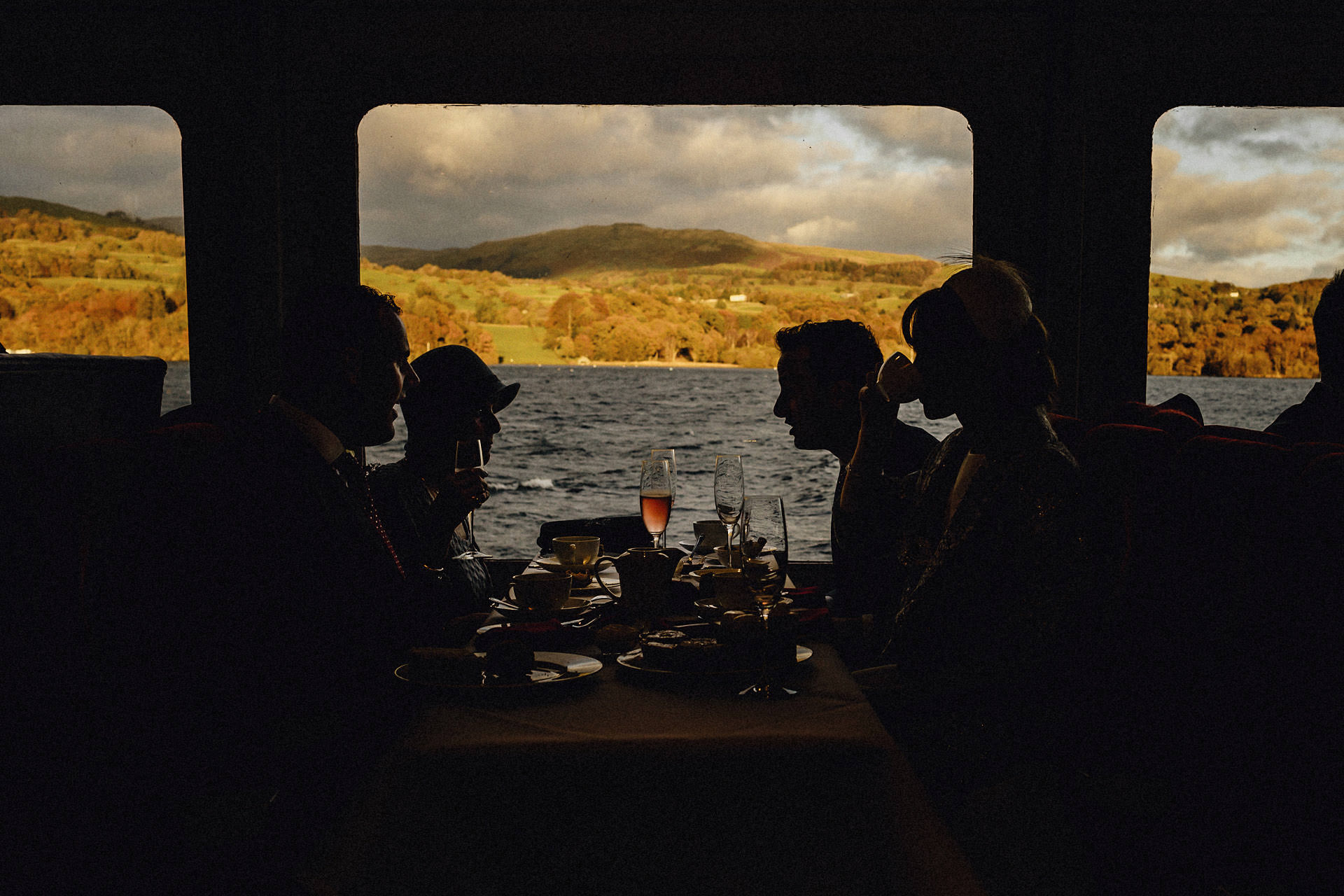 silhouette and view of the mountains outside the boat on windermere