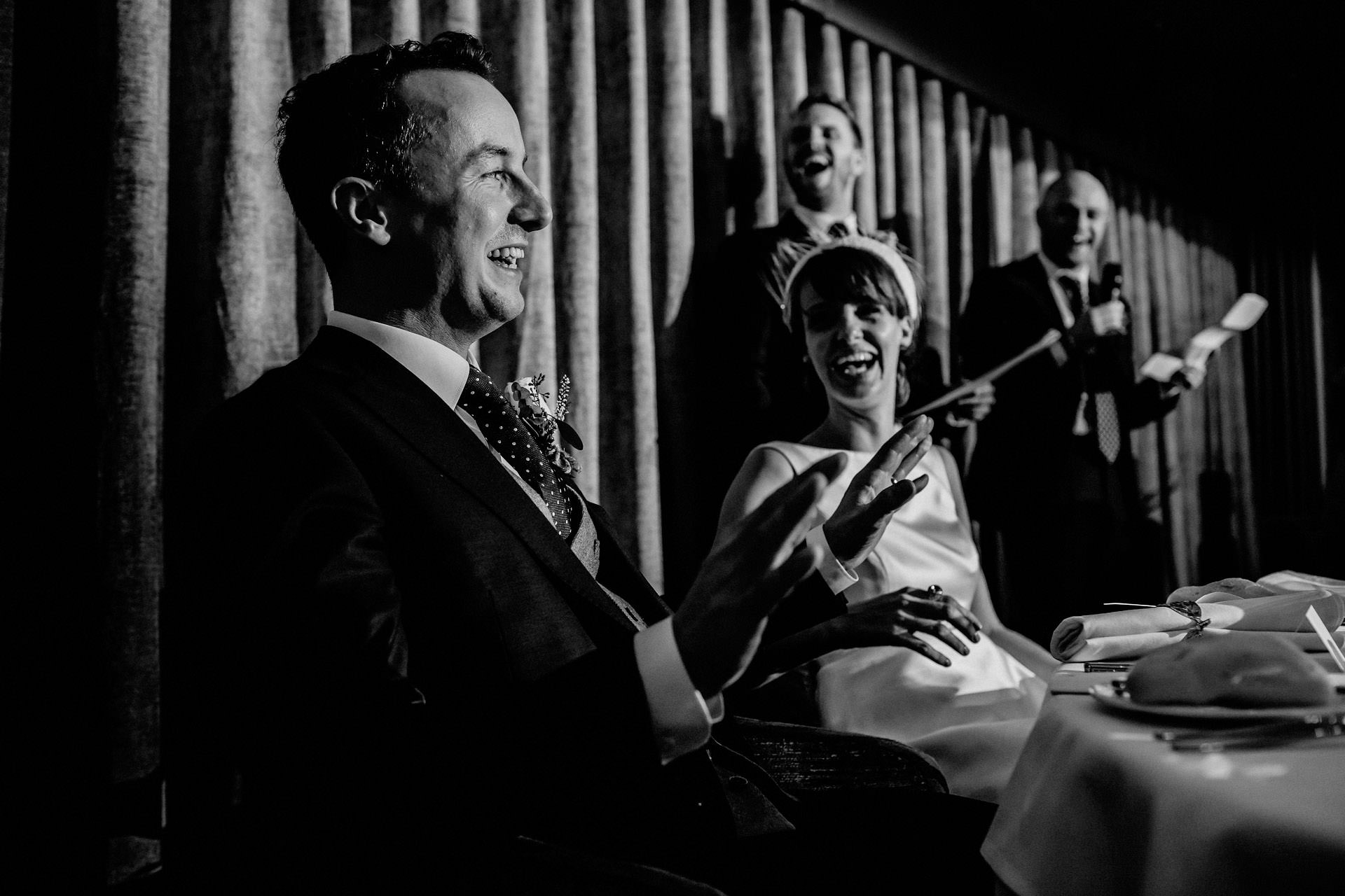 groom reacting during the best man speech