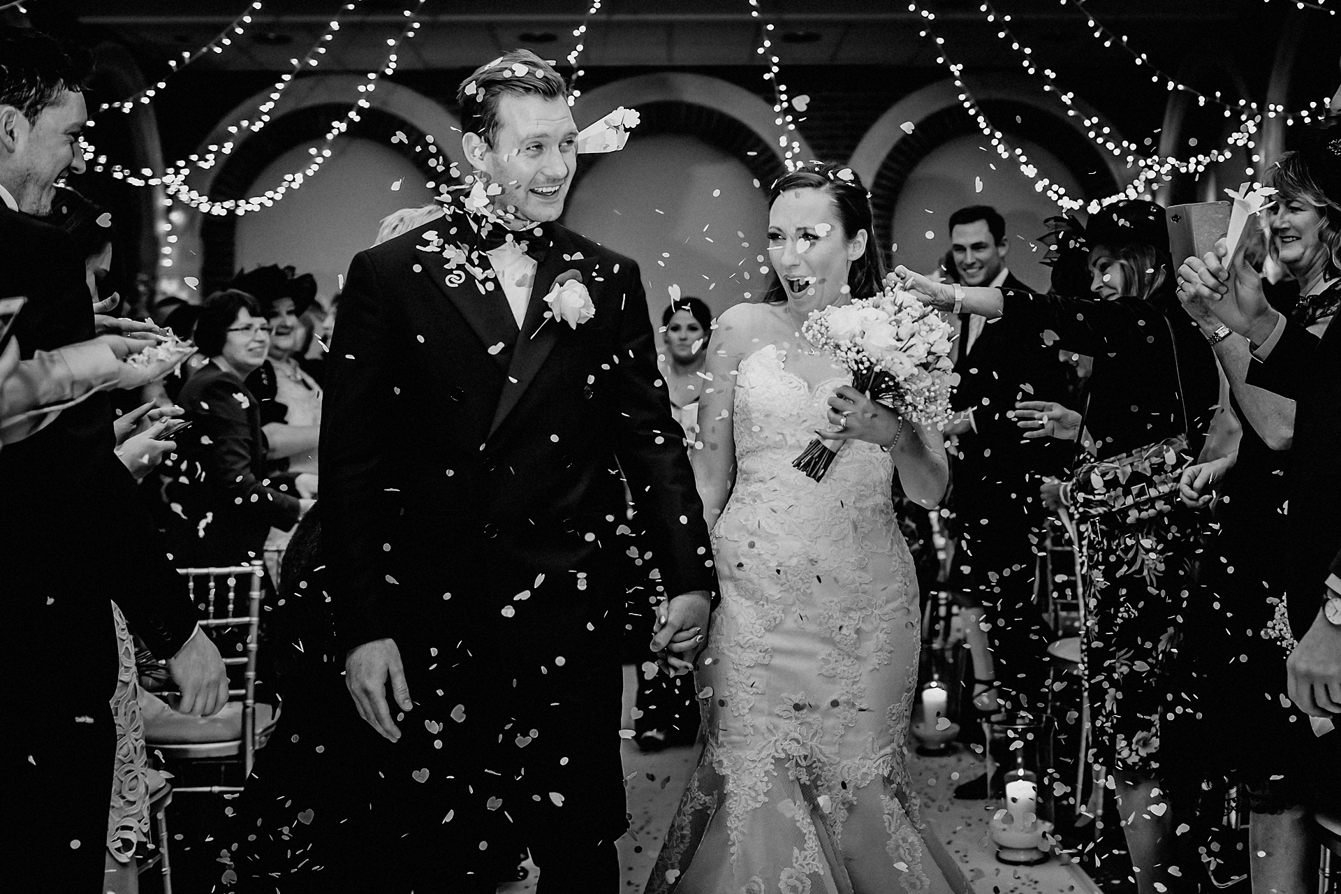 confetti throwing image of bride with boquet of flowers